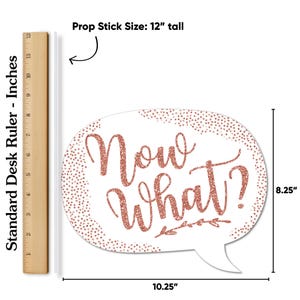 May include: A white speech bubble-shaped photo prop with the phrase "Now What?" in rose gold glitter. The prop is 10.25 inches wide and 8.25 inches tall, with a 12-inch tall prop stick.