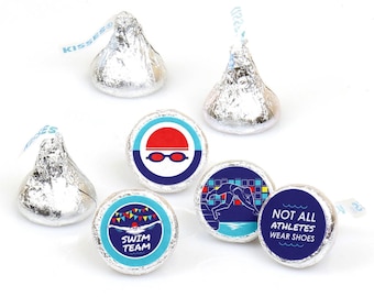 May include: Assortment of round, blue and white stickers with swimming-themed designs. The stickers feature a swimmer, a swim cap, goggles, and the text "Swim Team" and "Not All Athletes Wear Shoes".