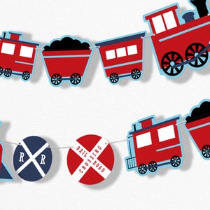 May include: A festive train-themed banner featuring red train cars, coal cars, and railroad crossing signs. The train cars have blue accents and black wheels. The railroad crossing signs are red and white with the words "RAIL CROSSING ROAD".