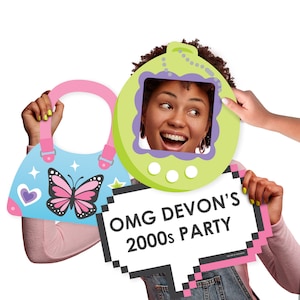 May include: Three photo booth props for a 2000s themed party. The props are a green and purple Tamagotchi, a blue purse with a pink butterfly, and a pink and black speech bubble with the text "OMG DEVON'S 2000s PARTY".
