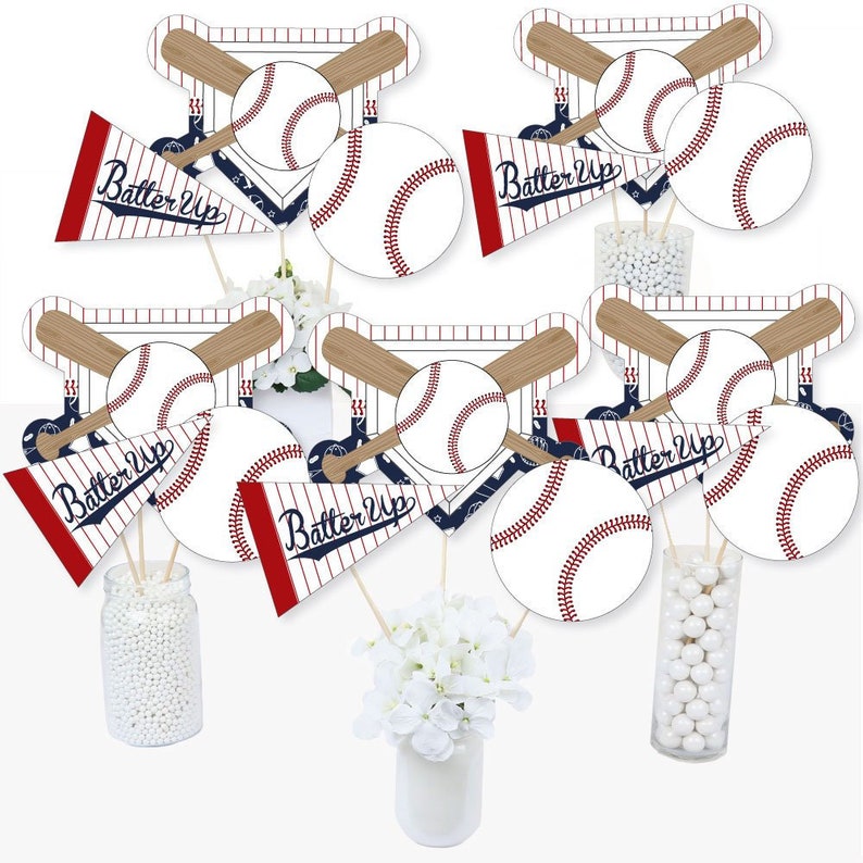 May include: Set of 12 baseball themed centerpieces. Each centerpiece features a baseball, bats, and a pennant with the text "Batter Up".