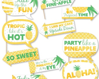 May include: A set of 10 yellow and green pineapple-themed photo booth props with fun sayings like "Slice Up the Fun", "Tropic Like It's Hot", "Party Like a Pineapple", and "Aloha!"