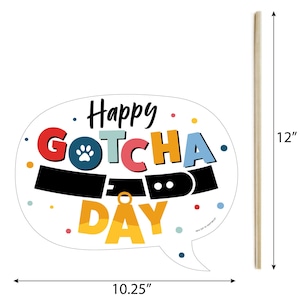 May include: A white speech bubble with colorful text that reads "Happy Gotcha Day" with a paw print and a dog collar graphic. The speech bubble is 10.25 inches wide and 12 inches tall.