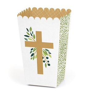 May include: White favor box with a gold cross and green leaves. The box has a scalloped edge and a green and gold patterned side.