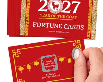 May include: A stack of red rectangular fortune cards for the 2027 Year of the Goat, featuring gold glitter borders and yellow geometric patterns. One card shows a scratch-off area with a lantern design and the text Happy news will soon come.