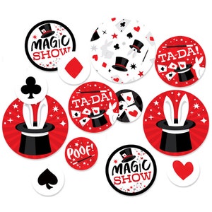 May include: A set of 12 red and white magic show themed party circle confetti. The confetti features images of a top hat, rabbit ears, playing cards, and the words "Magic Show", "Ta-Da!" and "Poof!"