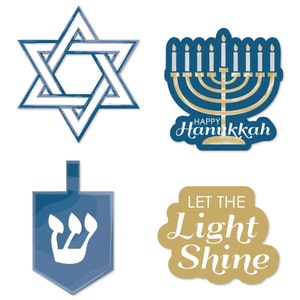 May include: Four blue and gold Hanukkah decorations. A Star of David, a menorah, a dreidel, and a sign that says "Let the Light Shine".