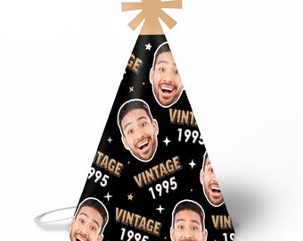 May include: Black party hat with a gold star on top. The hat has a repeating pattern of a man's face, gold stars, and the text "Vintage 1995".