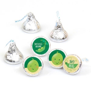 May include: A set of 6 green and yellow round stickers with the text "Two Peas in a Pod" and a cartoon pea design. The stickers are designed to be placed on chocolate kisses.