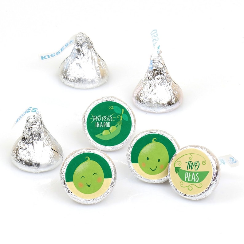May include: A set of 6 green and yellow round stickers with the text "Two Peas in a Pod" and a cartoon pea design. The stickers are designed to be placed on chocolate kisses.