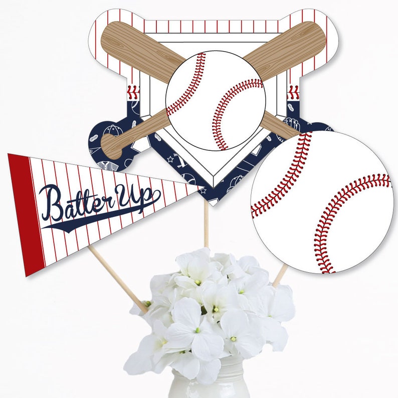 May include: Baseball themed centerpiece with a pennant flag that says "Batter Up" in navy blue lettering, a baseball and bat design, and a baseball with red stitching.