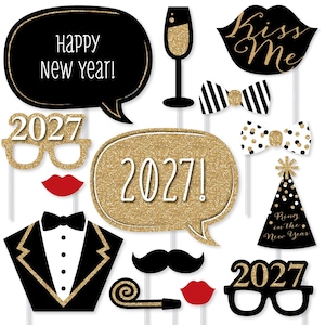 May include: A collection of New Year's Eve photo booth props including speech bubbles with text Happy New Year and 2027, a champagne flute, lips, bow ties, a party hat with text Ring in the New Year, a tuxedo front, a mustache, and 2027 glasses.
