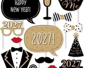 May include: A collection of New Year's Eve photo booth props including speech bubbles with text Happy New Year and 2027, a champagne flute, lips, bow ties, a party hat with text Ring in the New Year, a tuxedo front, a mustache, and 2027 glasses.