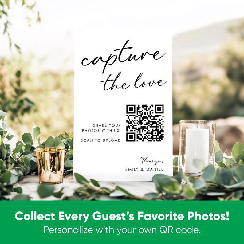 May include: A white rectangular sign with black text that reads capture the love, share your photos with us! scan to upload, and thank you, emily & daniel. The sign features a black QR code in the center and is displayed among green foliage.