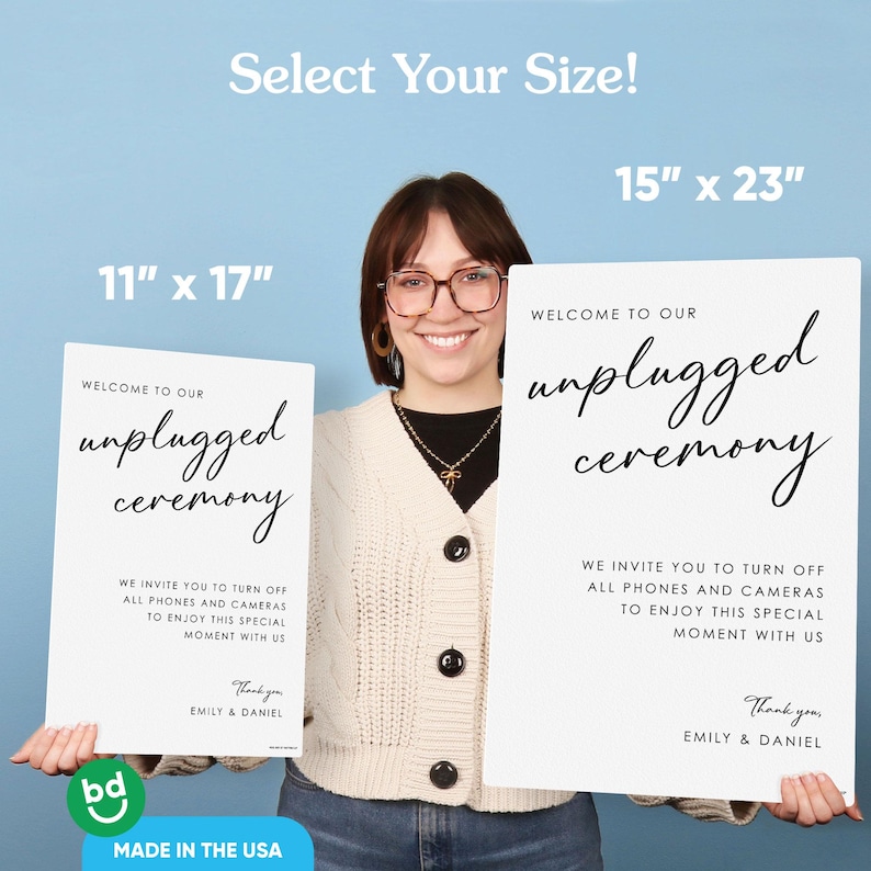 May include: Two white signs with black text that read "Welcome to our unplugged ceremony." The signs are 11" x 17" and 15" x 23". The signs also include the text "We invite you to turn off all phones and cameras to enjoy this special moment with us."