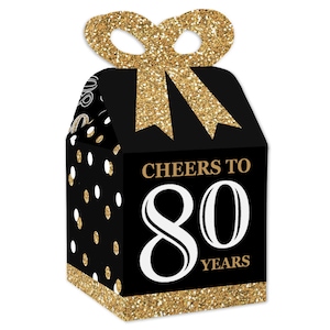 May include: Black and gold favor boxes with a gold glitter bow and white polka dots. The boxes say "Cheers to 80 Years".