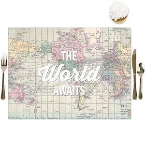 May include: A vintage world map placemat with a light blue background and colorful continents. The text "The World Awaits" is printed in white on the map.