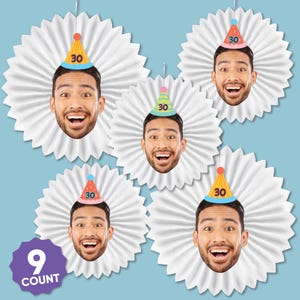 May include: A collection of five party decorations featuring a smiling face wearing a party hat with the number 30. Each face is set against a white, paper fan-shaped background, with a blue background. A purple label reads "9 COUNT".