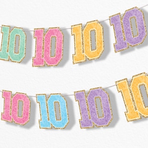May include: A festive banner with the number "10" repeated in various pastel colors, including mint green, pink, blue, orange, and purple. Each number is outlined in gold glitter and strung on a white string, perfect for a birthday celebration or milestone event.