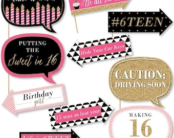 May include: A set of 10 pink, black and gold photo booth props with glitter accents. The props feature phrases such as "Make a wish!" and "Putting the Sweet in 16".