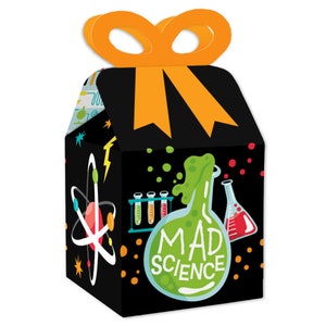 May include: A black and green favor box with a mad science theme. The box features a beaker with green liquid spilling out, test tubes, an atom, and the words "Mad Science". The box has a yellow ribbon handle.