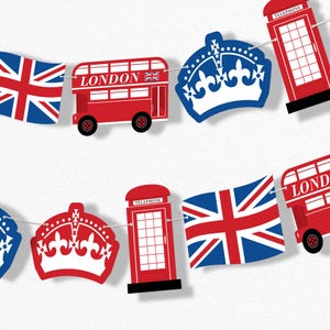 May include: A garland of British-themed paper cutouts. The design includes red double-decker buses with "LONDON" text, red telephone booths, blue crowns, and Union Jack flags. The garland is strung on a white string against a white background.