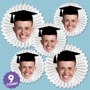May include: A collection of graduation-themed decorations featuring smiling faces wearing black graduation caps. Each face is set against a white, ruffled background. The image includes a purple label that reads "9 COUNT". The background is light blue.
