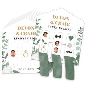 May include: Green and white wedding game with the text "Devon & Craig Lucky in Love" and the date "05.12.2026". The game includes a set of cards with images of a ring, a shoe, a bow tie, a heart, a rose, and a mustache.