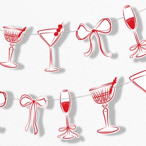 May include: A string of red and white paper cutouts of cocktail glasses, champagne flutes, and bows. The glasses are filled with red liquid and some have garnishes. The cutouts are strung together on a thin white string, creating a festive banner.