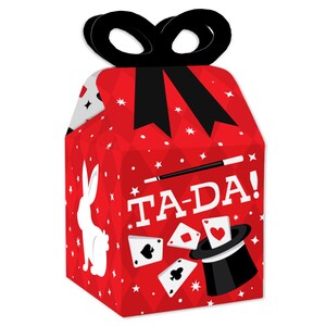 May include: Red and black favor boxes with a magic theme. The boxes feature a white rabbit, playing cards, a top hat, a magic wand, and the text "TA-DA!"