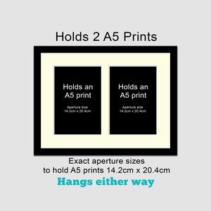 May include: Black picture frame with a white mat, holding two A5 prints. The frame has a black border and a white mat. The text "Holds 2 A5 Prints" is at the top of the frame. The text "Holds an A5 print" is in each of the two openings. The text "Aperture size 14.2cm x 20.4cm" is below each opening. The text "Exact aperture sizes to hold A5 prints 14.2cm x 20.4cm" is below the frame. The text "Hangs either way" is below the previous text.