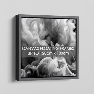 May include: A square black floating frame containing a black and white abstract image of swirling smoke. The text CANVASS FLOATING FRAMES UP TO 120cm x 100cm is printed in white across the centre of the frame over the smoke graphic.