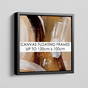 May include: A square canvas floating frame in black containing an abstract painting with brown, tan, and white brushstrokes. A white horizontal banner across the centre displays the black text: CANVAS FLOATING FRAMES UP TO 120cm x 100cm.