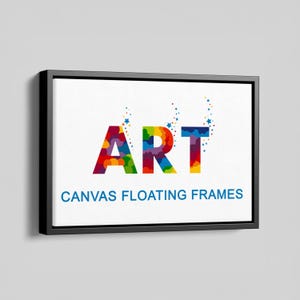 May include: A rectangular canvas print in a black floating frame. The word ART is printed in large, multicoloured letters with small star accents rising from the top. Below the word ART, the text CANVAS FLOATING FRAMES is printed in blue.