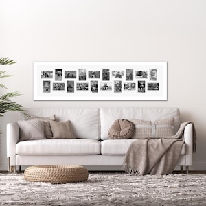 May include: A long, horizontal white picture frame containing a collage of twenty individual black and white photographs. The frame features a clean, rectangular design that holds the various small images in a structured, side-by-side arrangement.