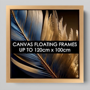 May include: A close-up of a framed canvas print featuring a blue and gold feather. The frame is made of natural wood and has a floating effect. The text "CANVAS FLOATING FRAMES UP TO 120cm x 100cm" is printed on the bottom of the image.