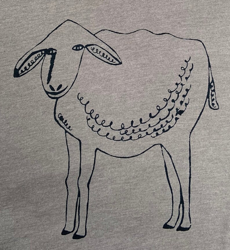 May include: A black and white illustration of a sheep with a curly tail and a decorative pattern on its back.