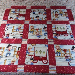 Cowboy themed baby or child&#39;s patchwork quilt w/ little cowboys sitting around the campfire and chuck wagon. Cute & unique fabric. 39&quot;sq