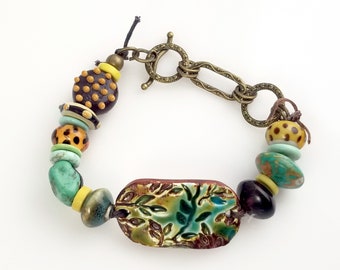 Colorful Ceramic Bracelet with Leaf Focal and Various Ceramic and Glass Beads. VN149