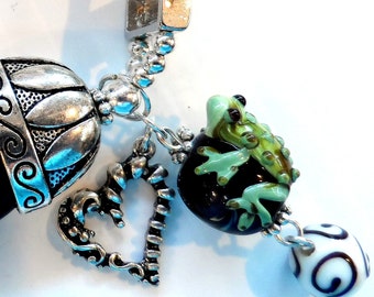 Tree Frog Bracelet Features Two Toads and a Tadpole Clutching Their Favorite Bead
