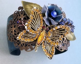 Butterfly Cuff Bracelet, Custom Blue Bronze Patina,  Filigree with Rhinestone Butterfly and Blue Flower Rhinestones, Enamel Leaves VB109