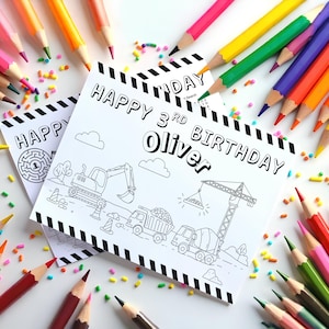 May include: A birthday colouring page with the text "HAPPY 3rd BIRTHDAY Oliver" and construction-themed illustrations. The page is surrounded by colourful pencils and sprinkles, creating a festive and creative scene.