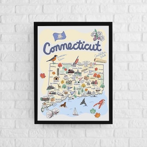 May include: A framed illustrated map of Connecticut featuring the state name in blue script, the American Robin, the state flag, and various icons representing local landmarks, wildlife, and flora, all set against a light yellow background.