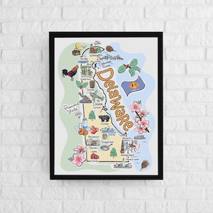 May include: A framed illustrated map of Delaware featuring the state name in large orange letters. The map includes colorful drawings of local landmarks, flora, fauna, and the state flag, set against a light blue and green background.