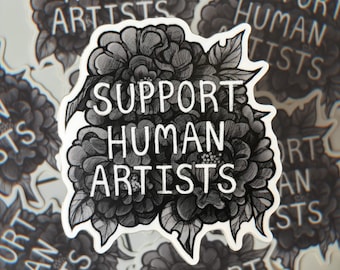 Op de afbeelding: Een zwart-witte sticker met een bloemmotief en de tekst "Support Human Artists".