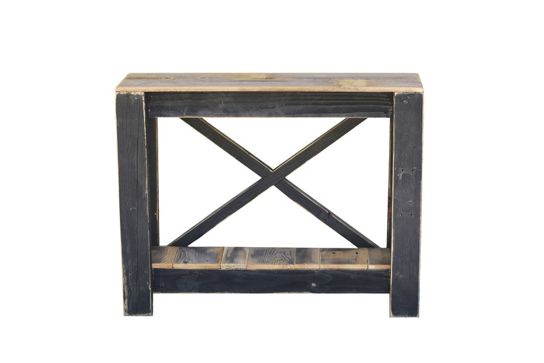May include: A black wooden console table with a distressed finish. The table has a single shelf and an X-shaped support structure.