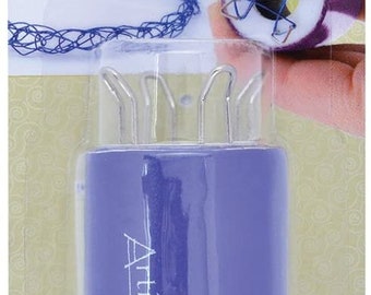 May include: A purple plastic 4-prong wire knitter tool with the text "Artistic Wire" on the side. The tool is packaged on a yellow background with the text "4 PRONG WIRE KNITTER TOOL TRICOTIN À 4 CROCHETS TRICOTÍN DE 4 DIENTES" and "Instruction Sheet Included! Mode d'emploi Inclus! Incluye Instructivo" on the packaging.