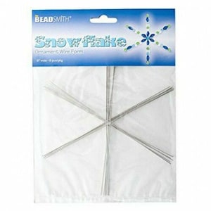 May include: A pack of six silver snowflake wire forms for making beaded ornaments. The pack is labelled "Beadsmith Snowflake Ornament Wire Form".