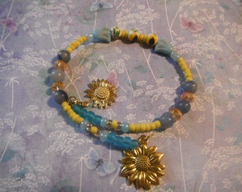 Beaded Charm Adjustable Bracelet/Awareness for Ukraine/Sunflower beads/two gold Sunflower Charms
