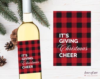 May include: Red and black buffalo plaid wine bottle label with the text "It's Giving Christmas Cheer".